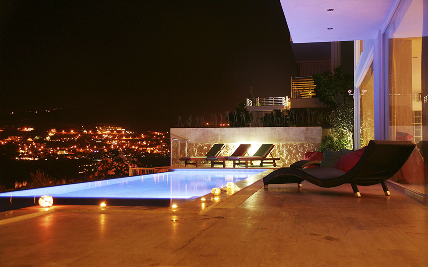 The terrace illuminated after dark.