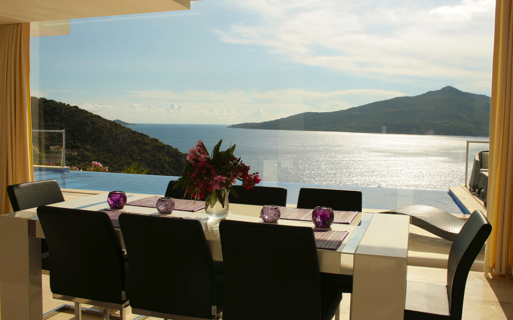 Dining area framed by the bay.